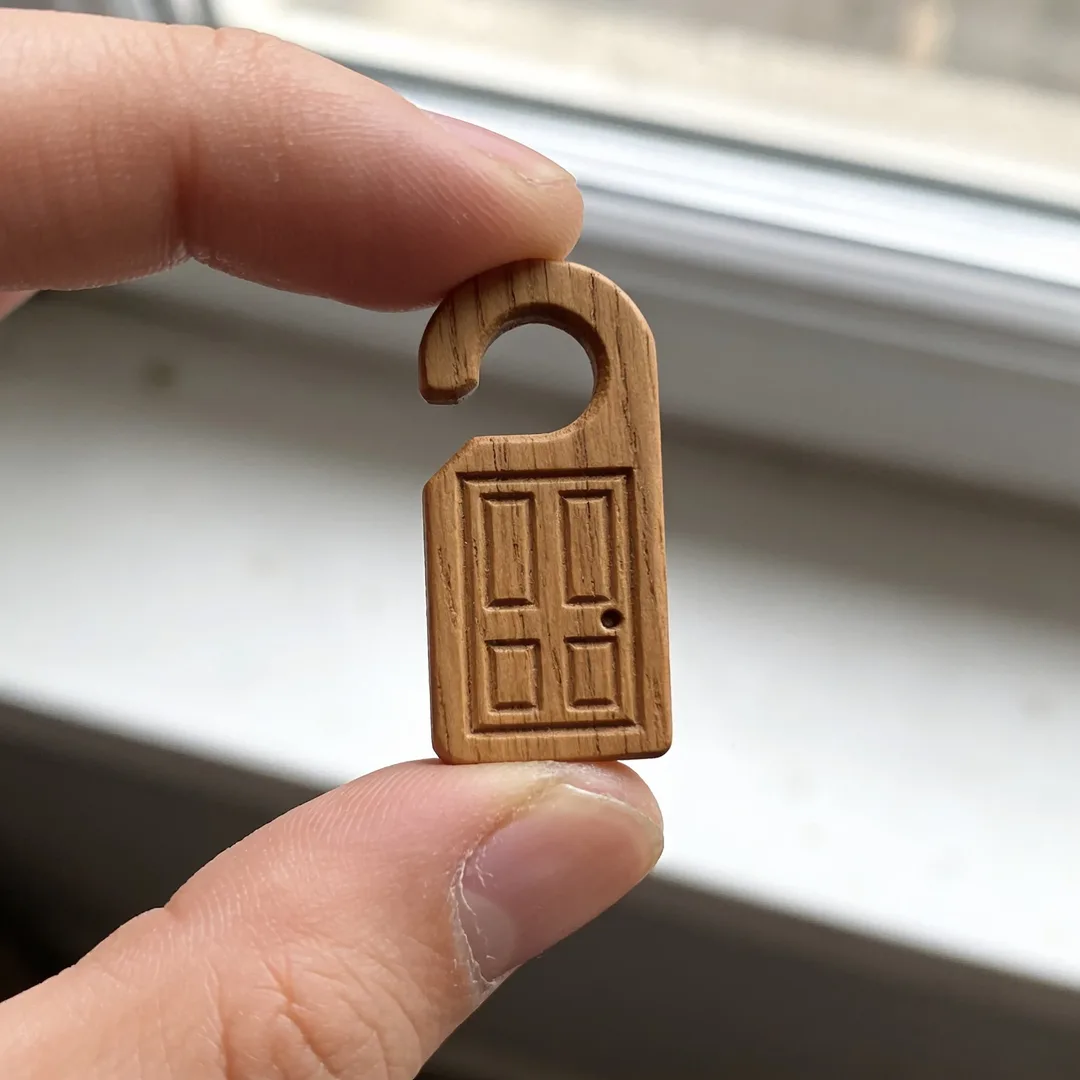 Carved wooden door hanger